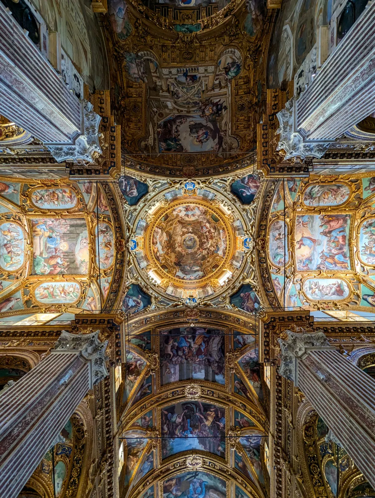Church vault covered with frescoes and gilded stucco