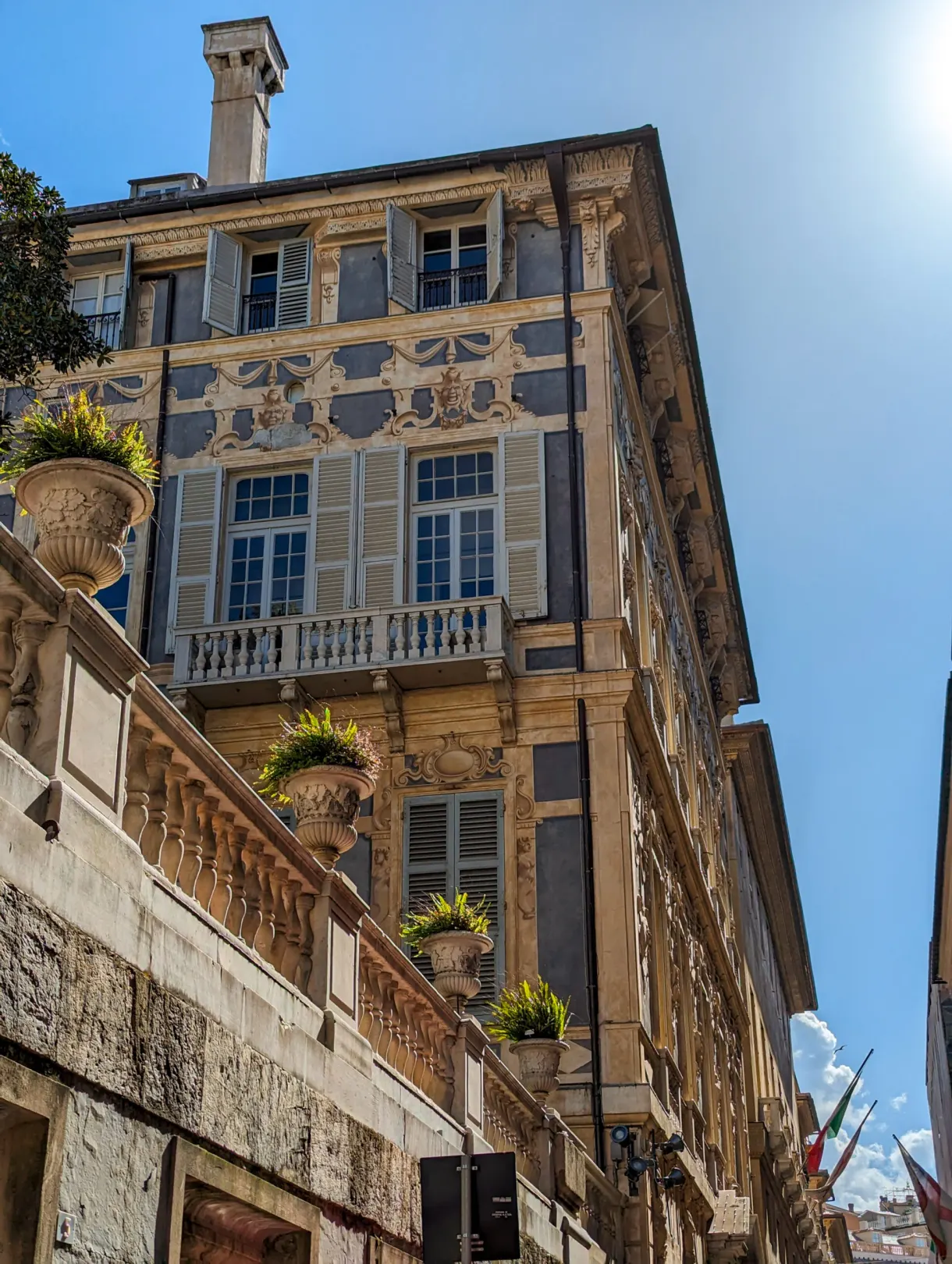 Renaissance palace and its stone balustrade seen from the street
