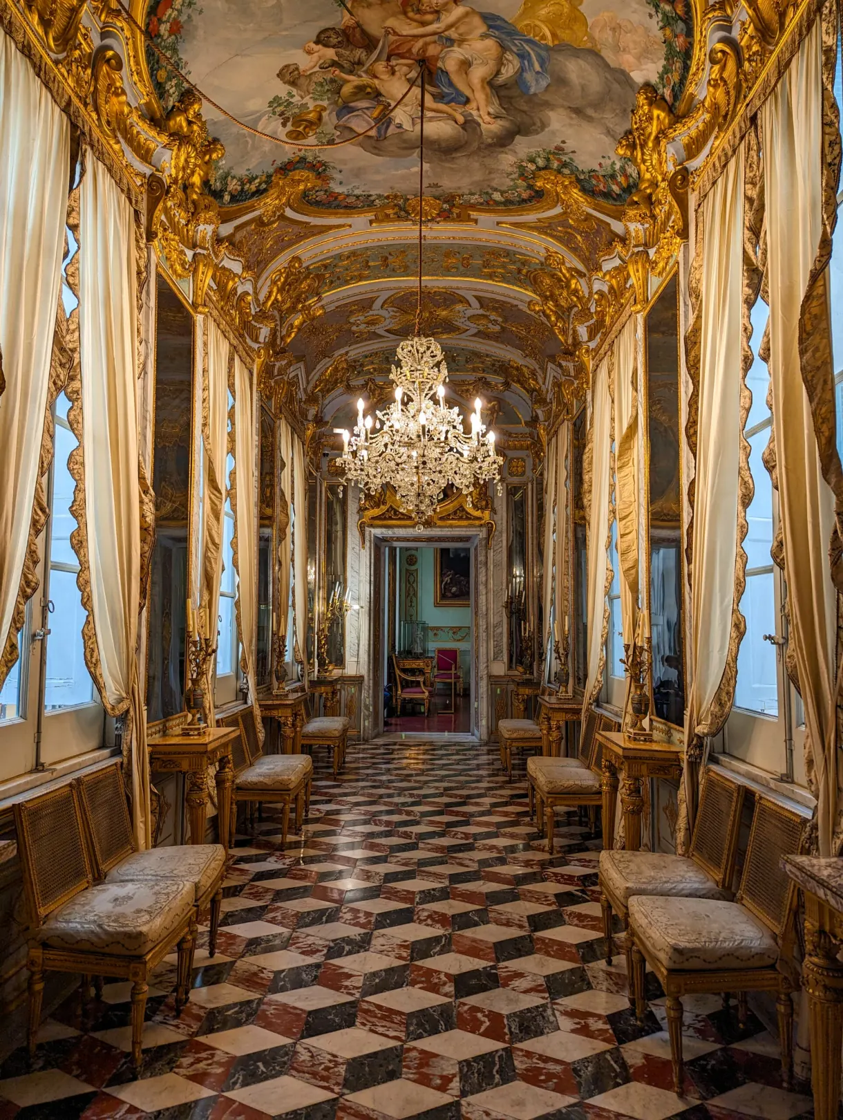 Row of gilded drawing rooms and upholstered armchairs