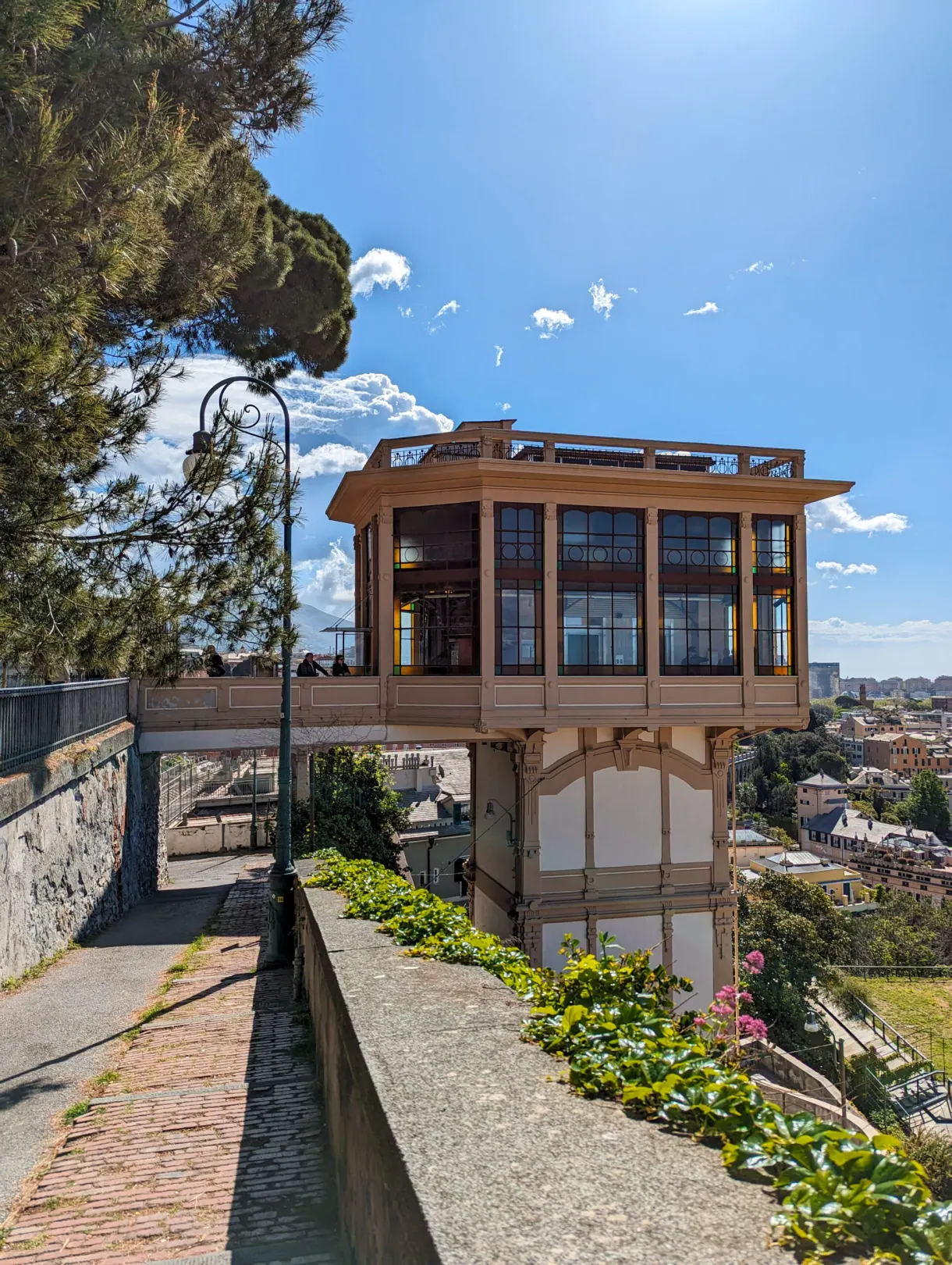 Glazed cabin of a panoramic lift at the end of a walkway