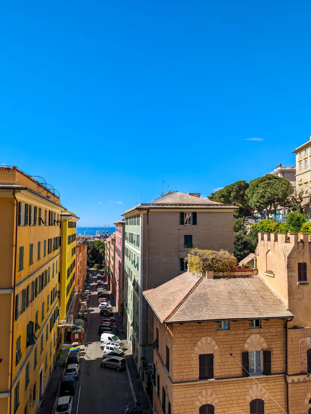 Sloping street and tiled roofs running down towards the sea