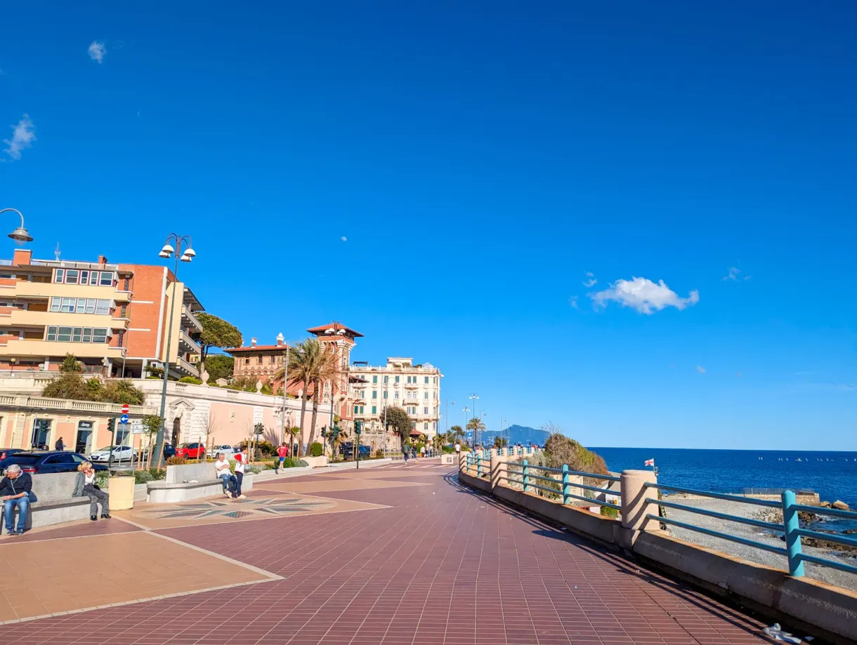 Long seafront promenade under a clear sky