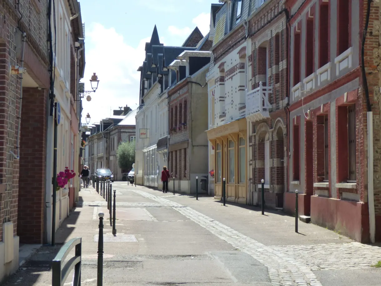 Wide avenue in Yport and its colourful seaside facades