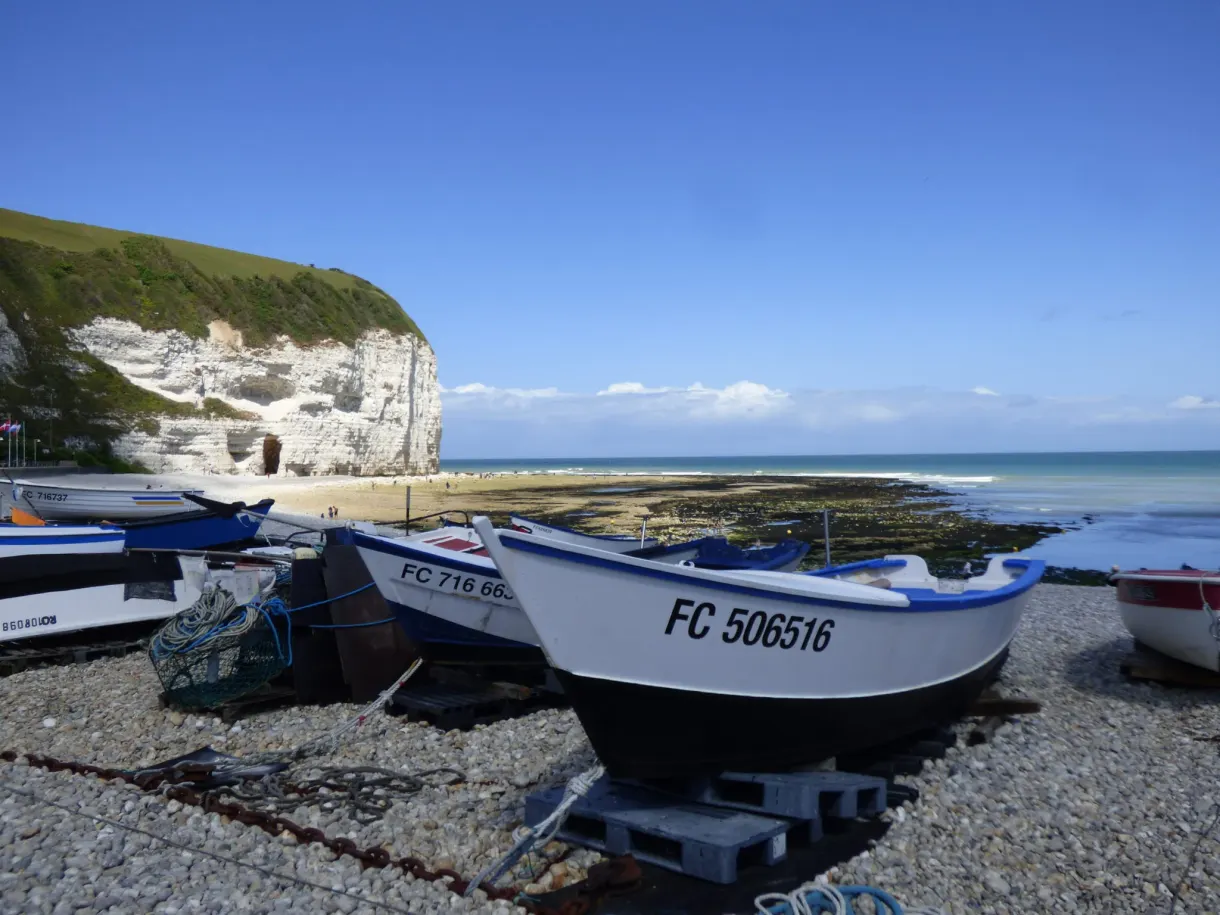 Fishing boat registered FC 506516 resting on the pebbles