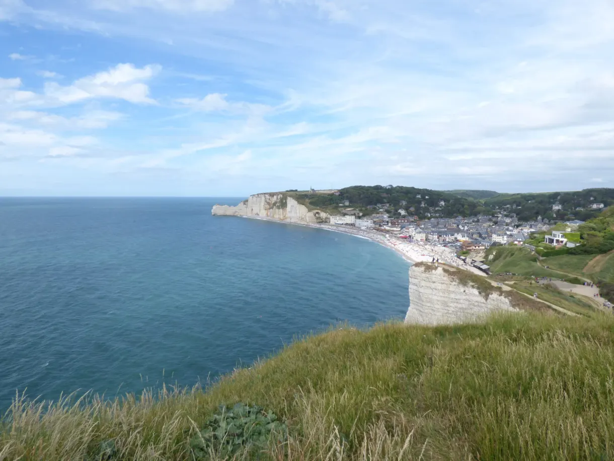 Bay of Étretat and its town seen from the top of the cliff