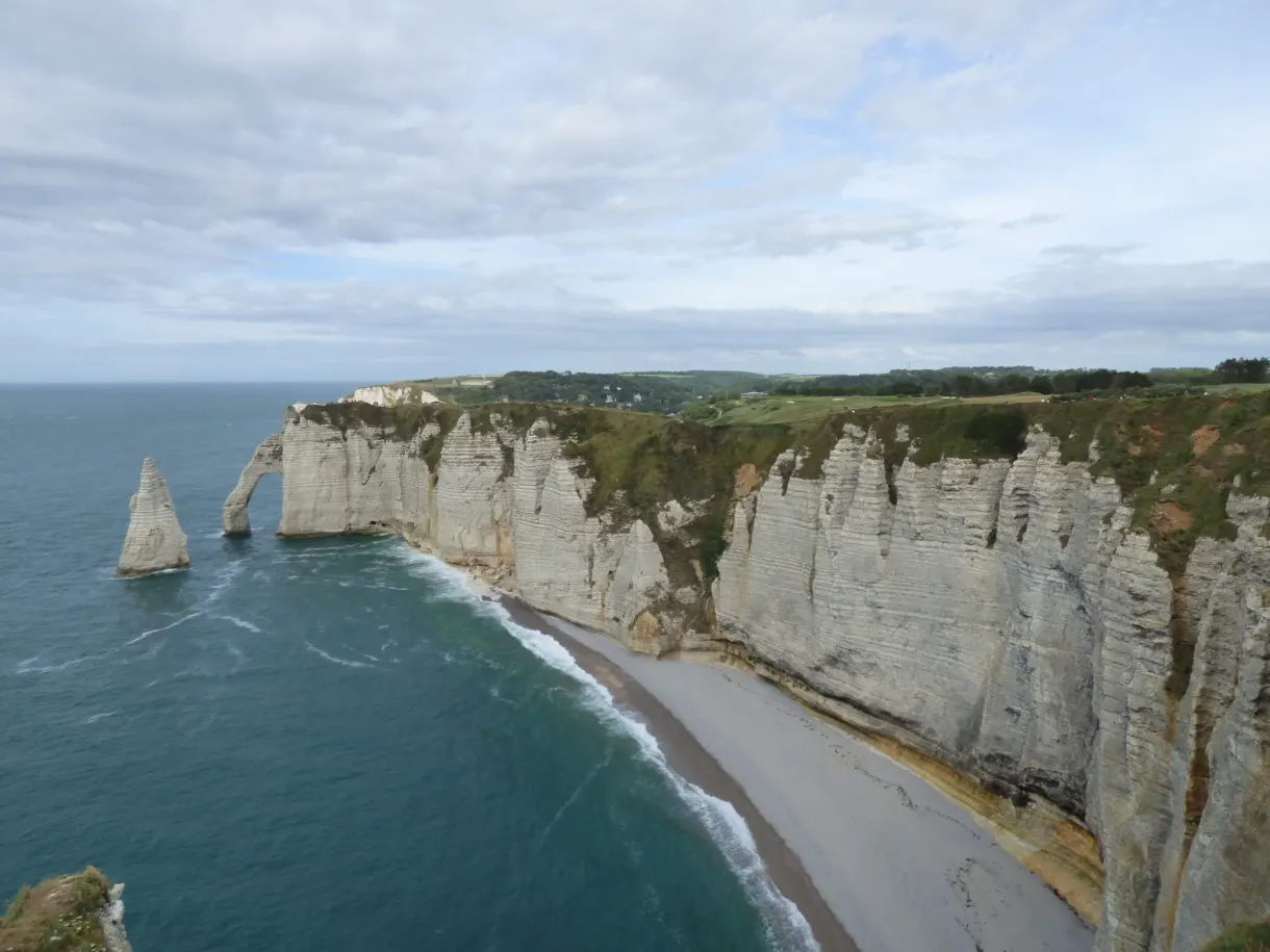 Long succession of chalk cliffs and a solitary needle