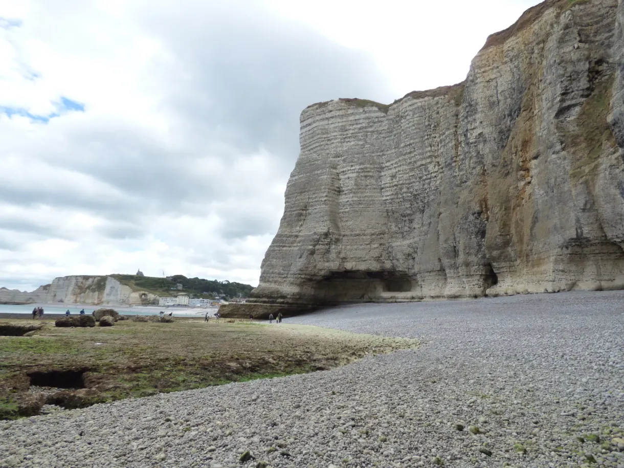 Immense chalk cliff and long deserted pebble beach