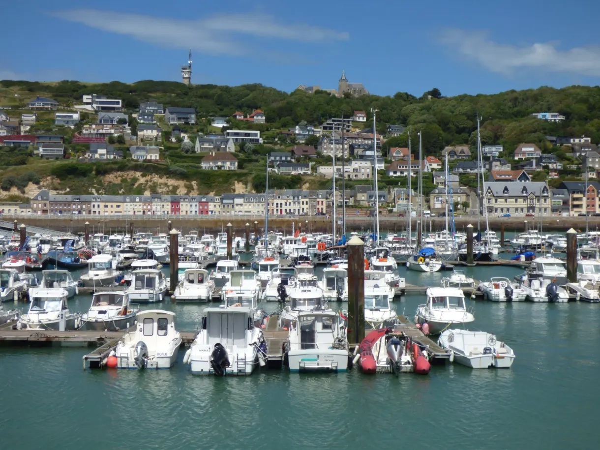 Pontoons of the marina in front of the houses on the hillside
