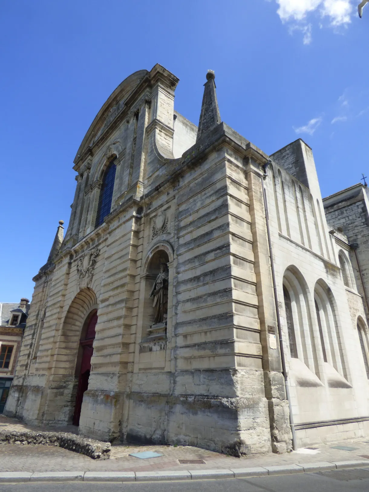 Carved stone doorway of a religious building in Fécamp