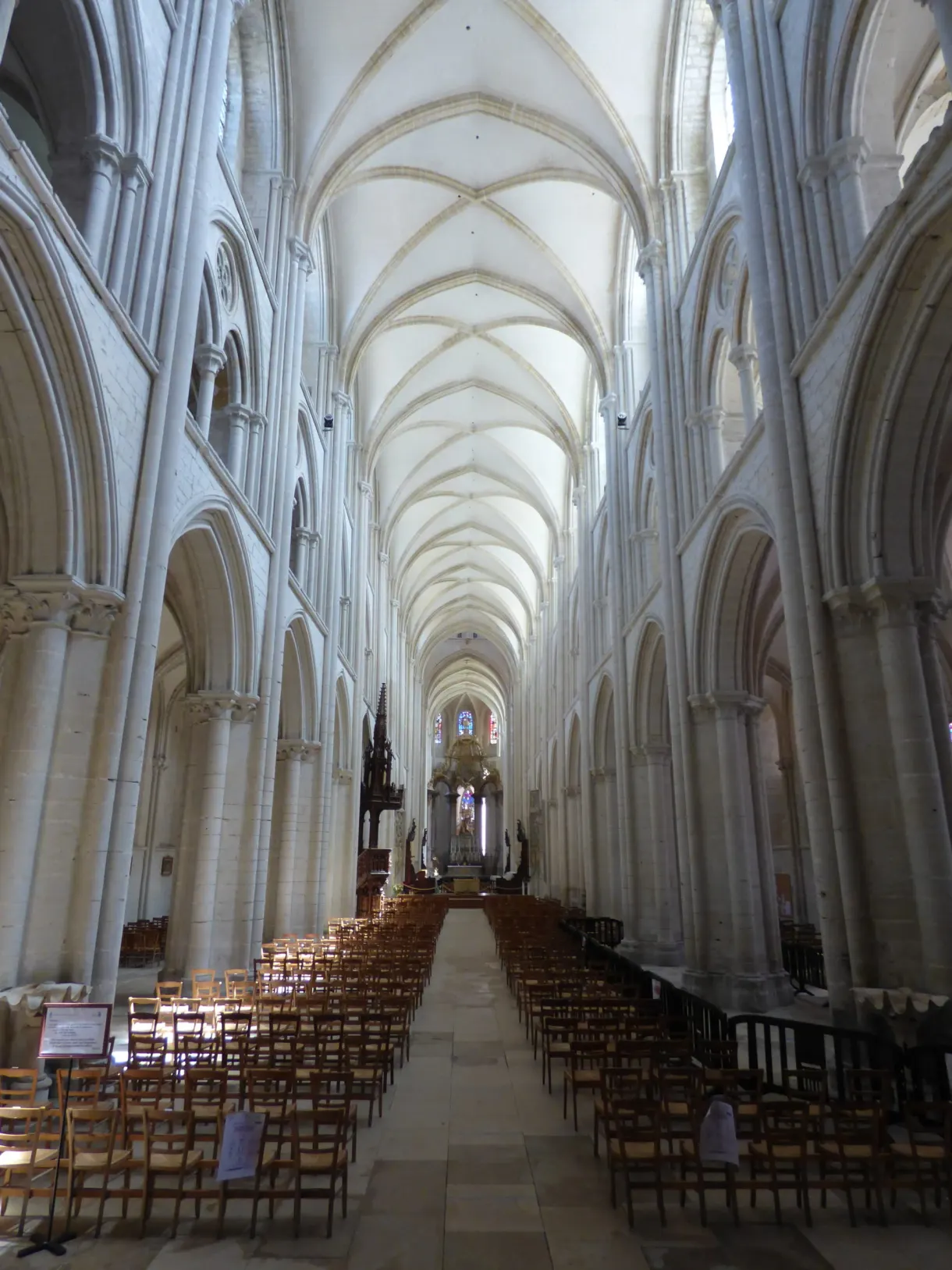 Light Gothic nave of the Abbey of the Trinity, chairs lined up