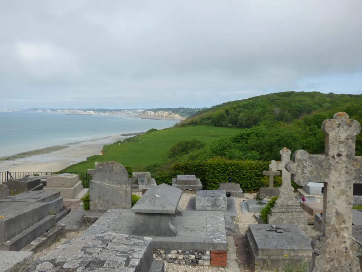 Graves in the seaside cemetery overlooking the sea and the green valley