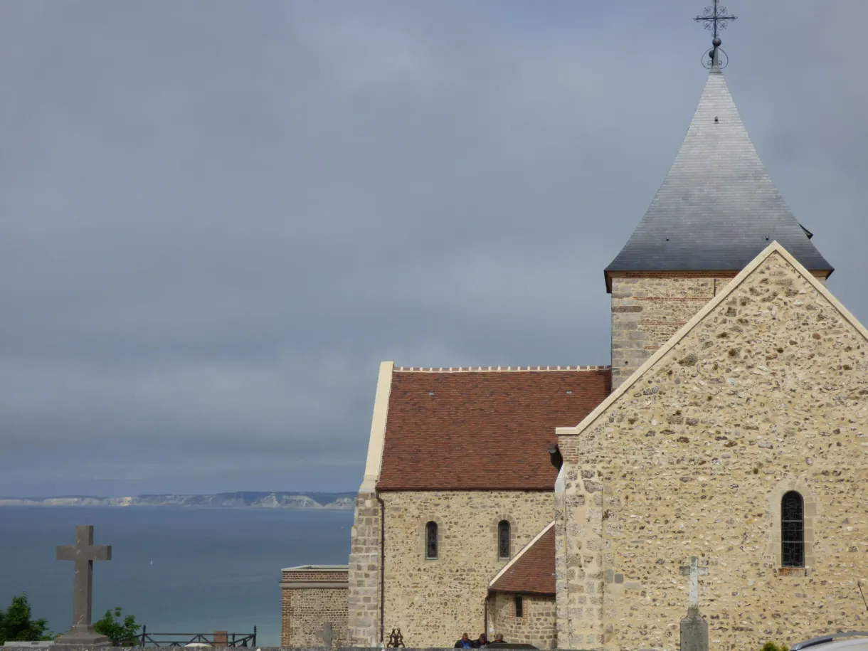 Stone church and its calvary cross above the sea