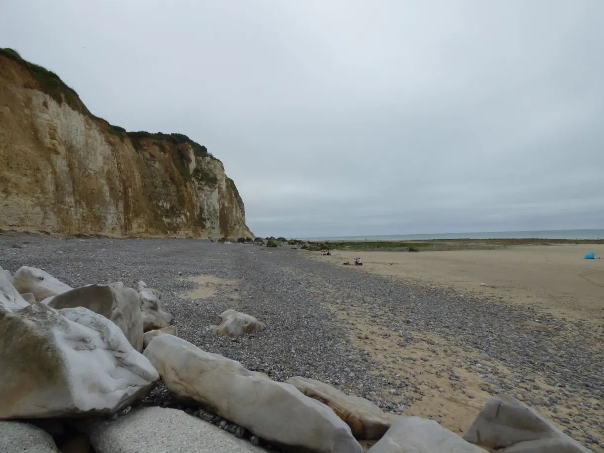 Large blocks of white chalk washed up on the pebble foreshore
