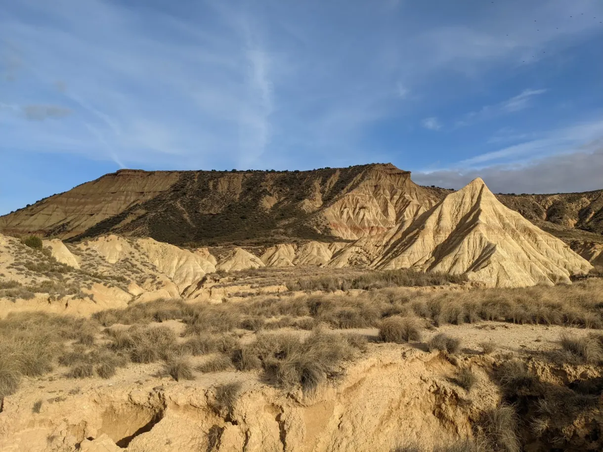 Ochre plateau cut up by erosion in the sunshine