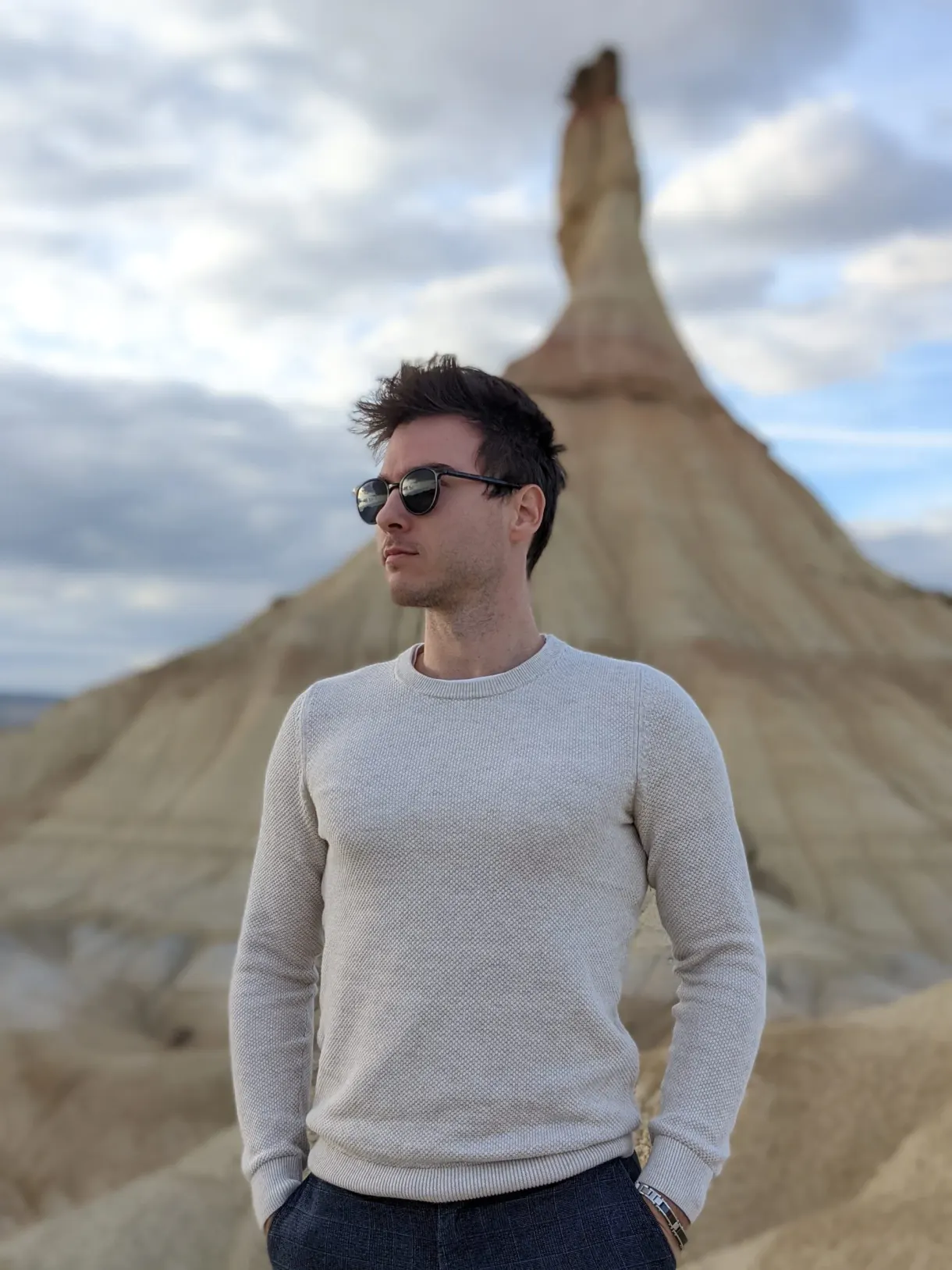 Portrait in a pale jumper, hoodoo blurred in the background