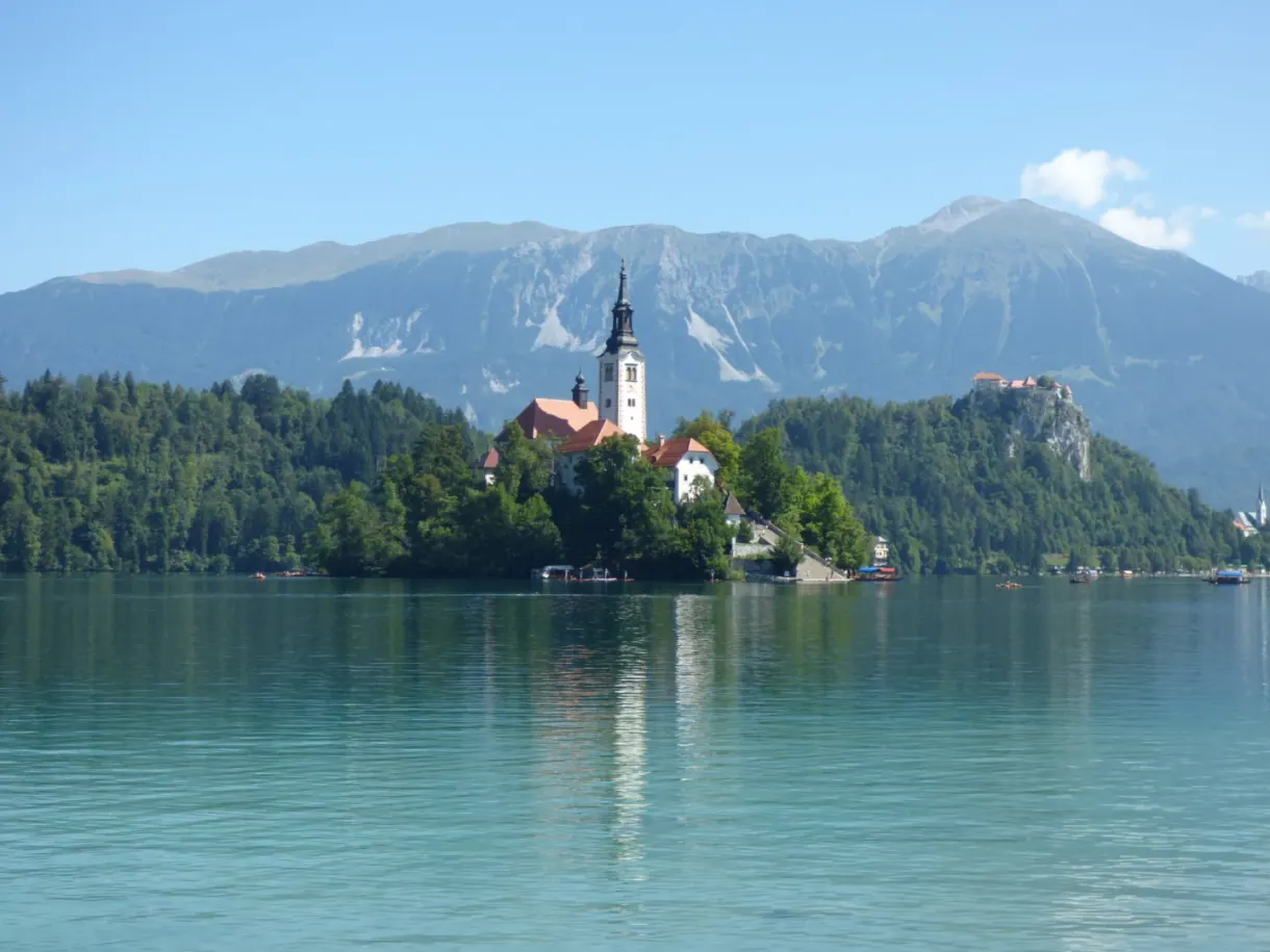 Wooded island at the foot of the Slovenian mountains