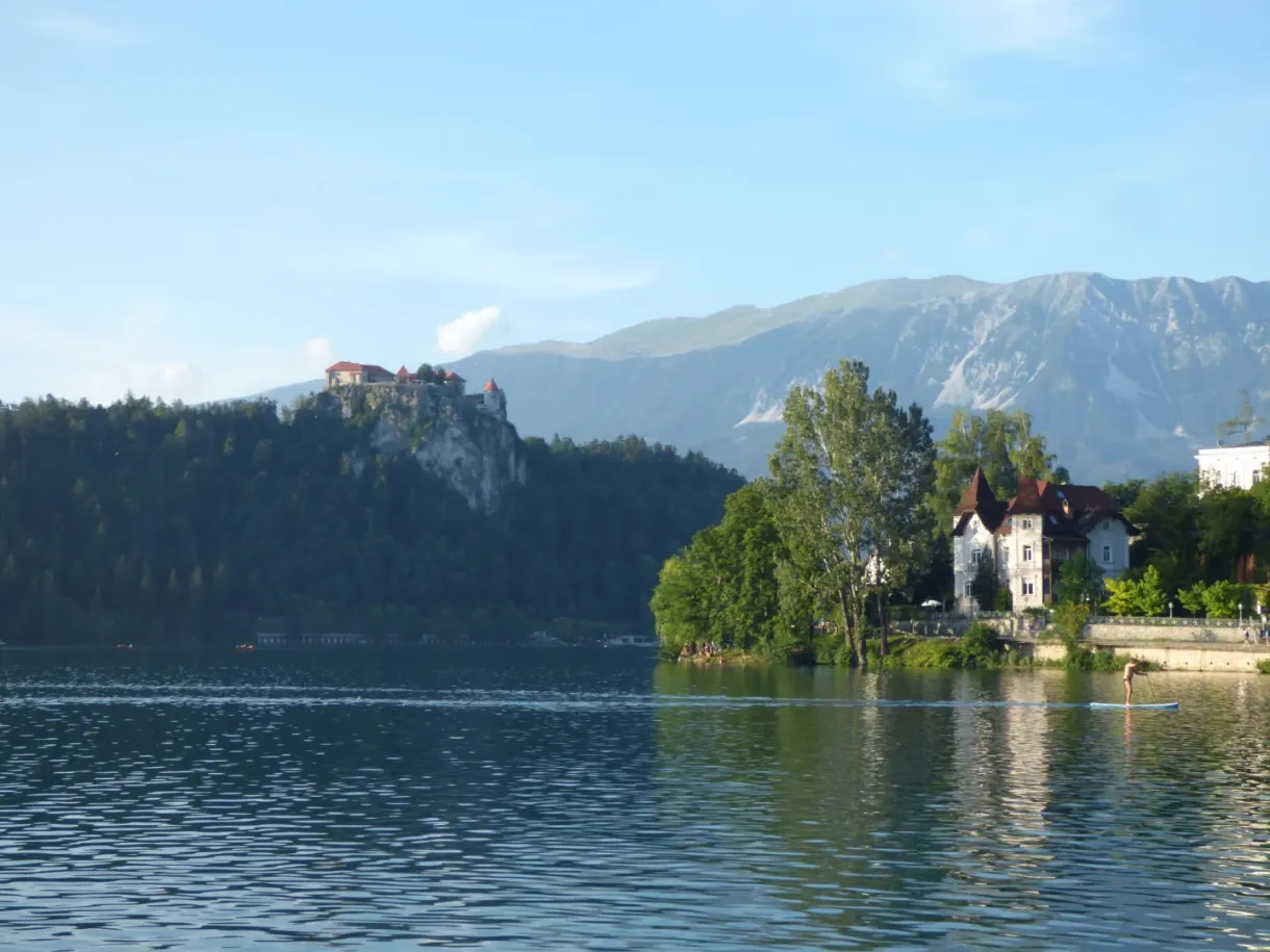 Castle standing on its cliff and villa at the water's edge