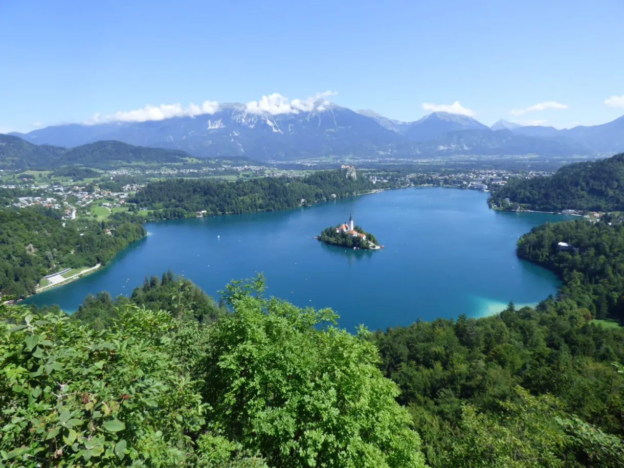 Commanding view of the lake ringed with forests and peaks
