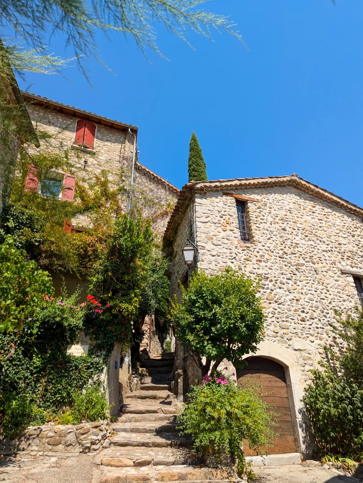 Stone staircase climbing between the old houses