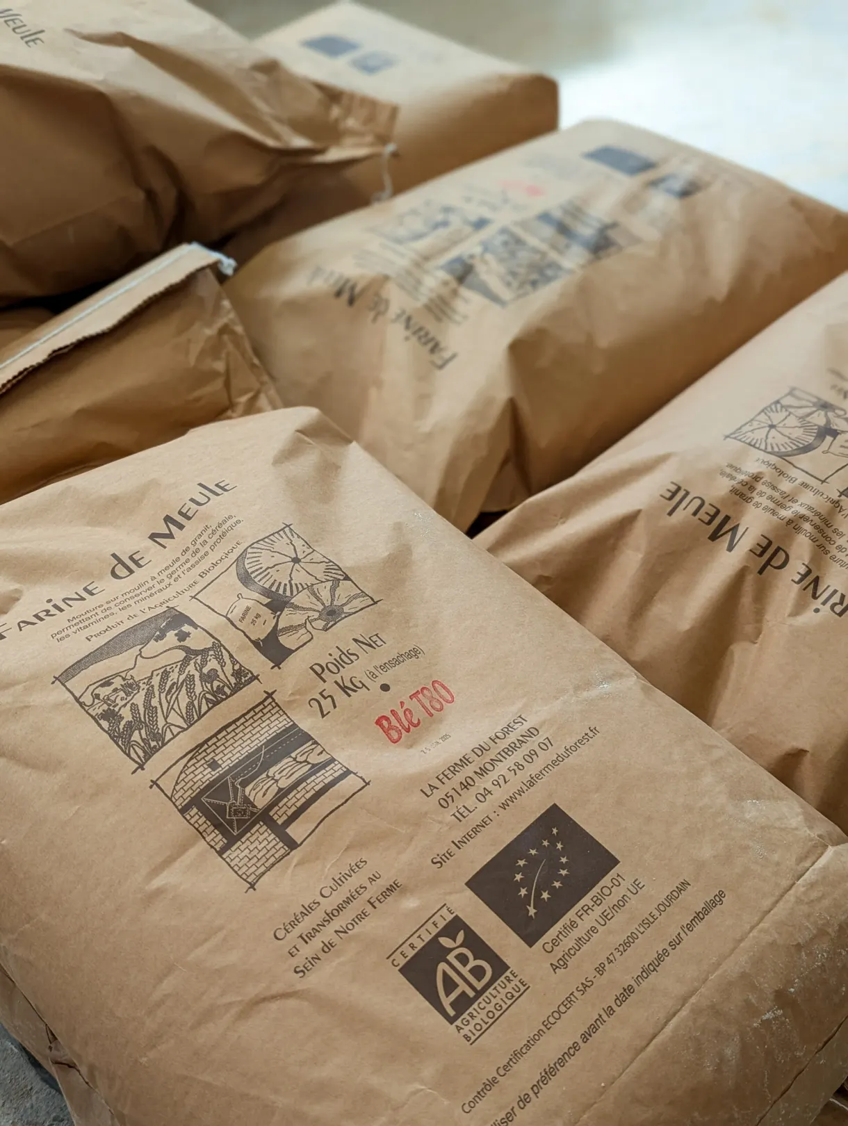 Kraft paper bags of flour stacked at the miller's