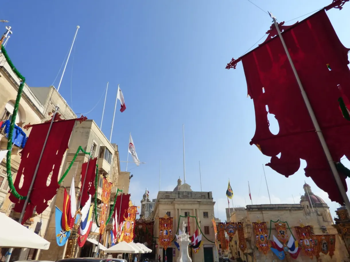 Red flags and garlands strung above the square