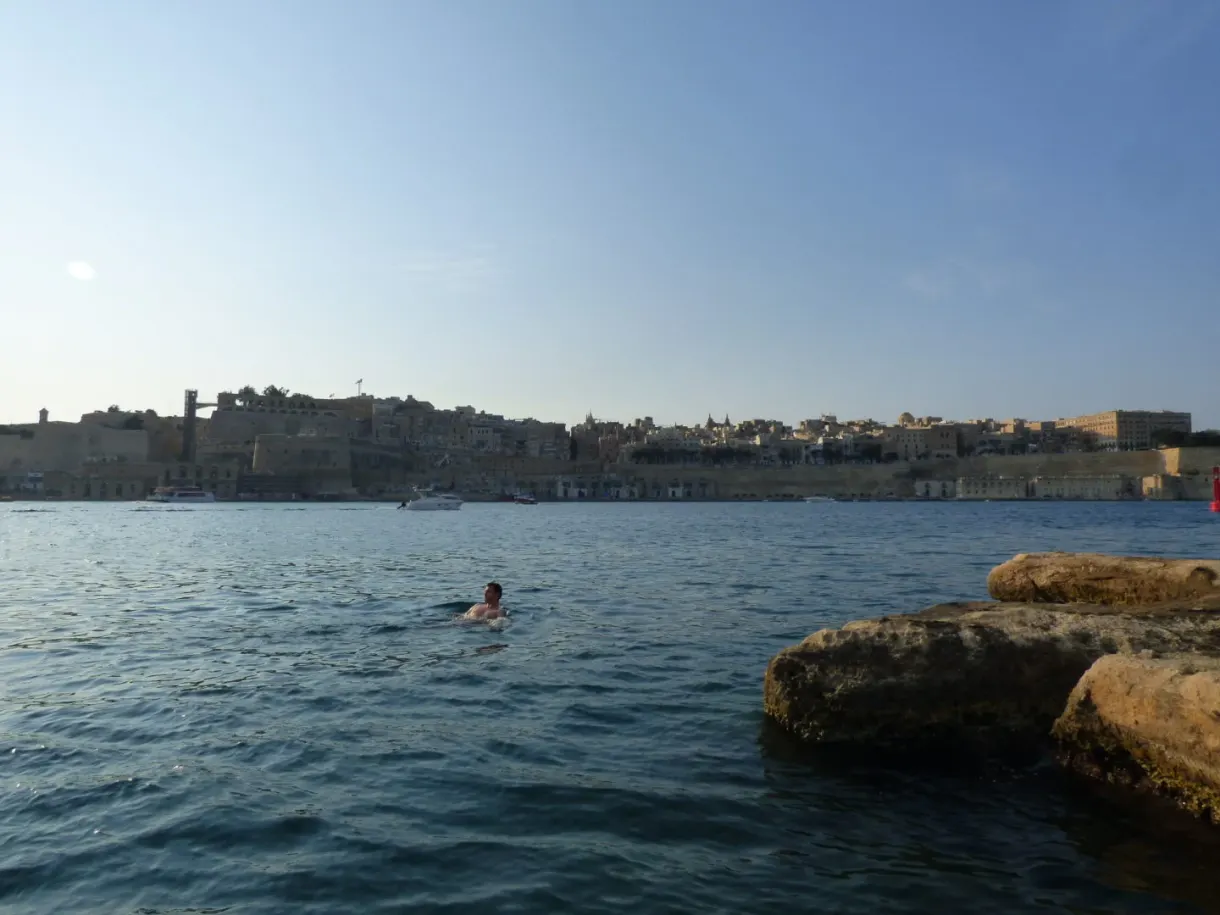 Swimmer at the foot of the ramparts in the Grand Harbour
