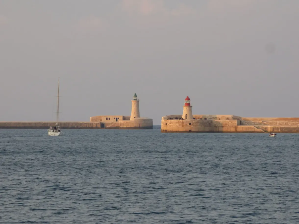 Red and white lighthouses guarding the harbour entrance