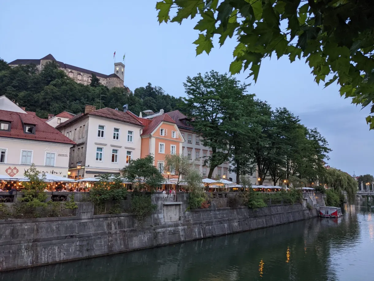 Quays lined with terraces with the perched castle in the background