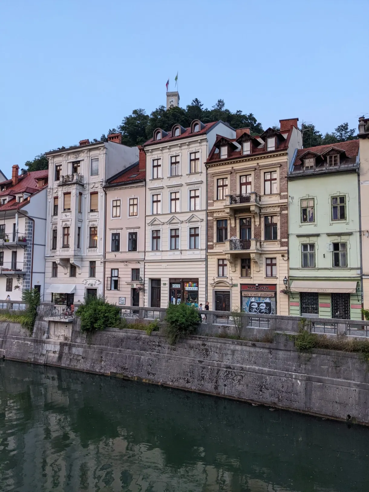 Pastel facades lined up above the stone quay