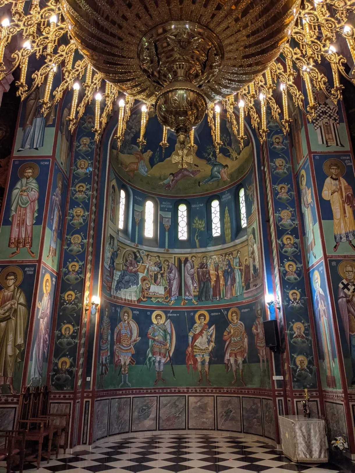 Blue dome covered with painted saints above the altar