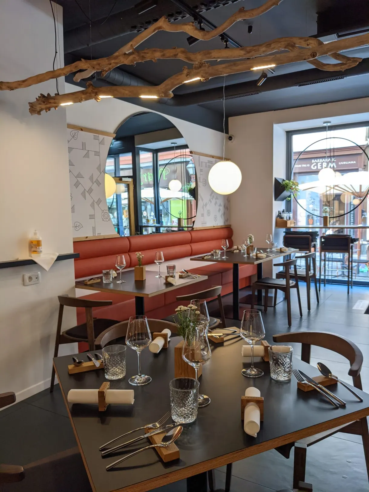 Restaurant room with terracotta bench seats and laid tables