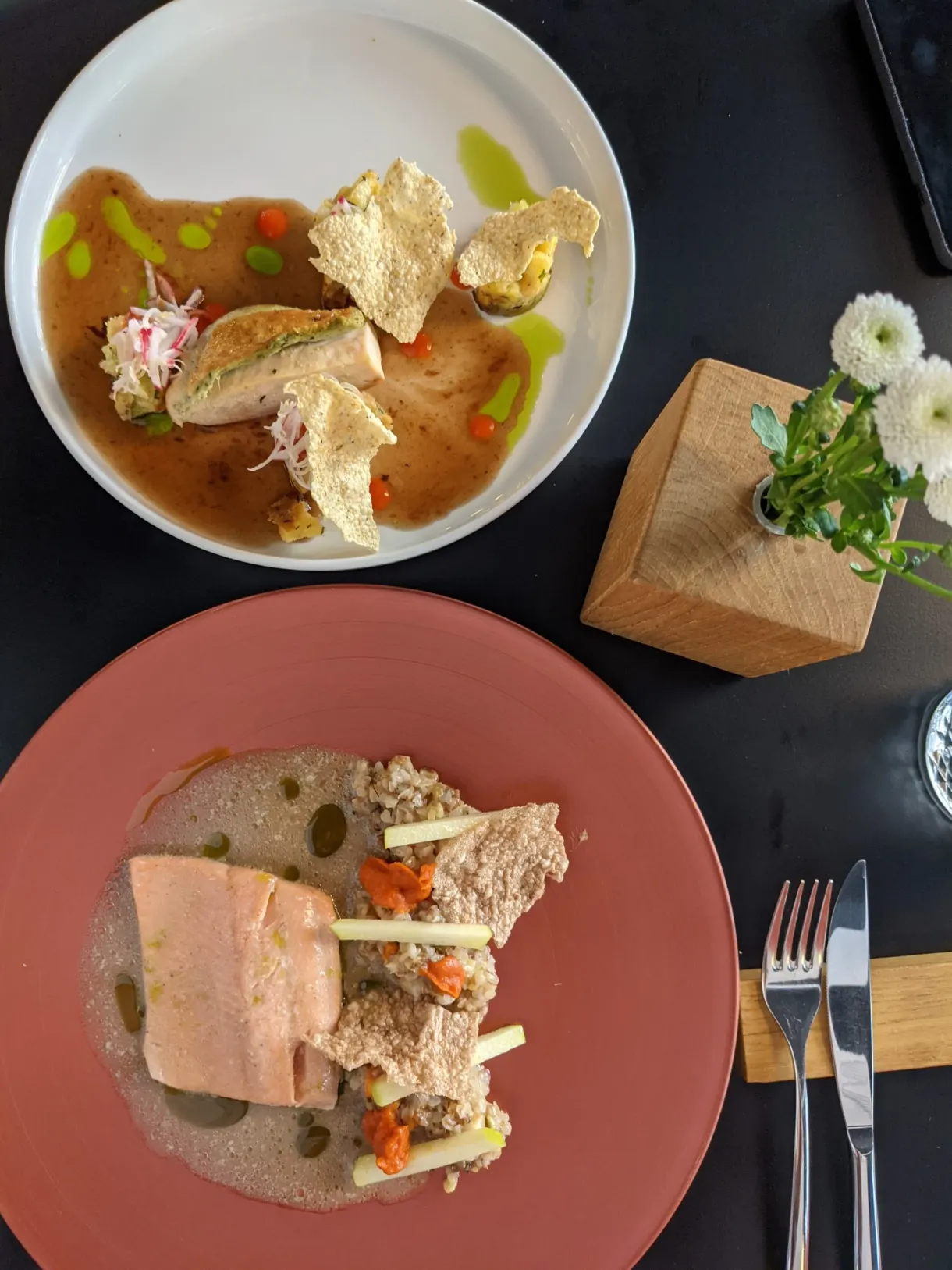 Two fine dining plates photographed from directly above