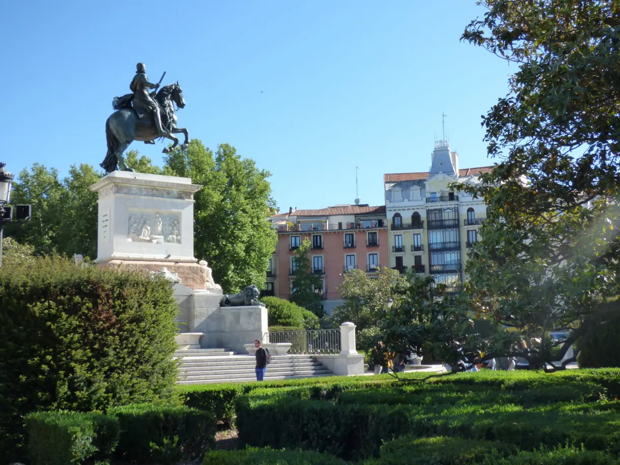 Bronze horseman overlooking a garden planted with trees