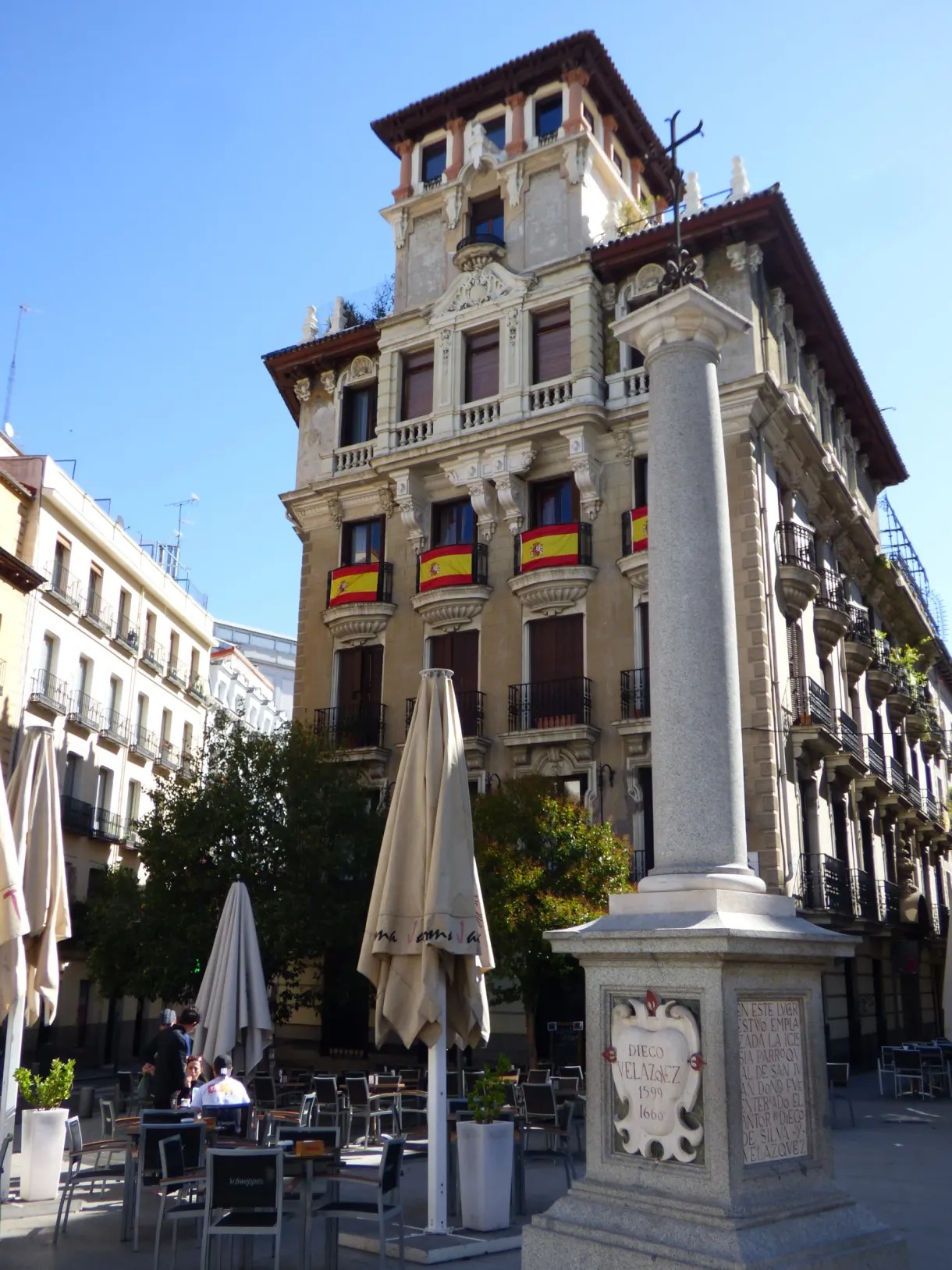 Stone column and terraces at the foot of a corner building