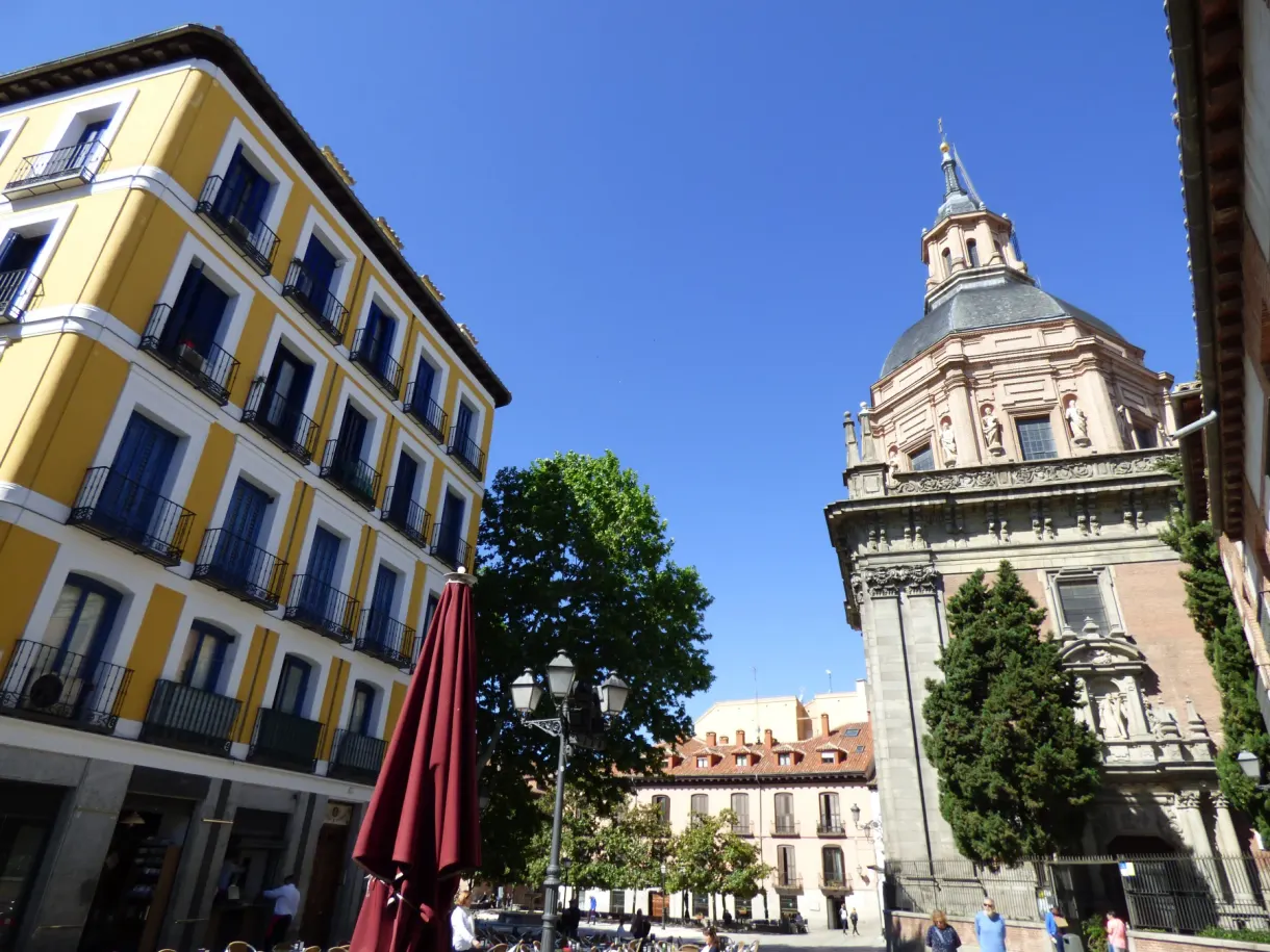 Bright yellow facade next to a baroque church