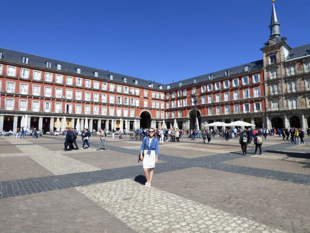 Red arcades of the Plaza Mayor and its pale paving