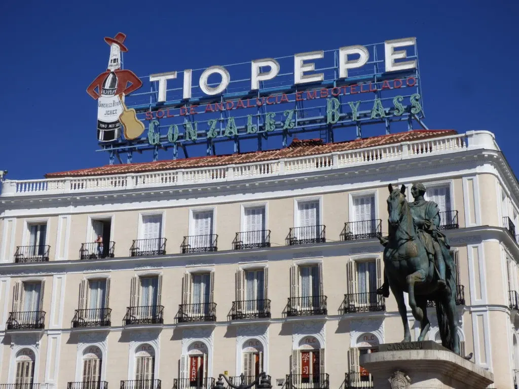 Illuminated Tio Pepe sign crowning a building