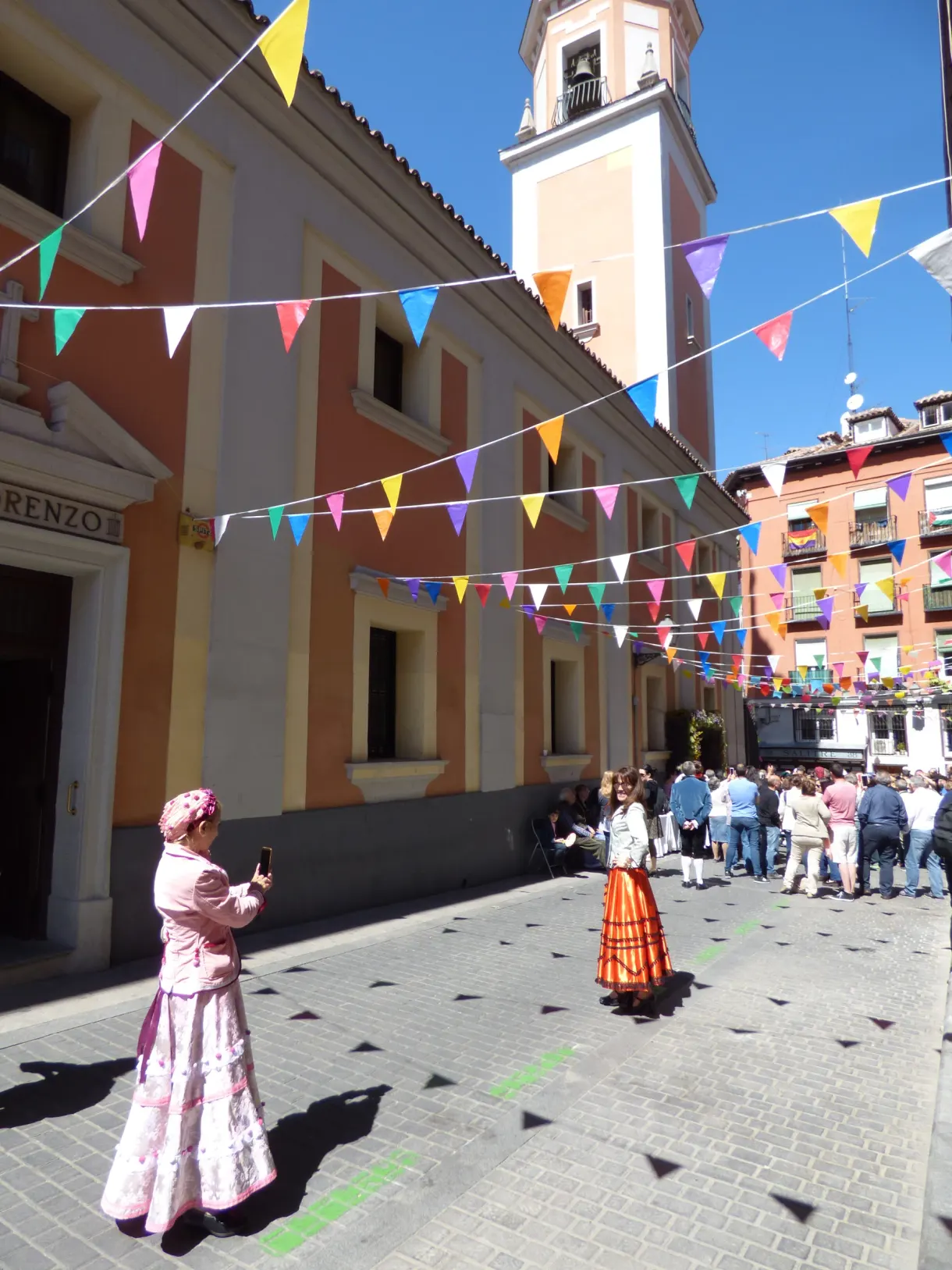 Colourful bunting strung above a street in festive mood