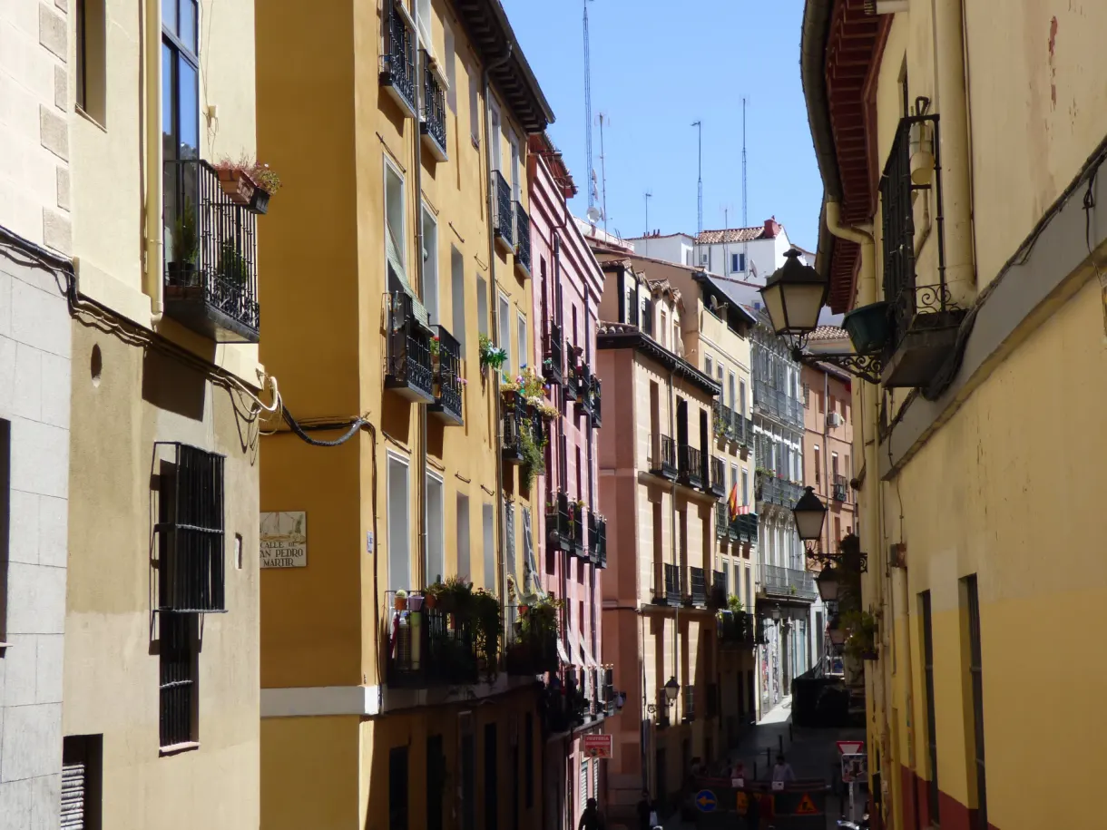 Narrow street with yellow and ochre facades