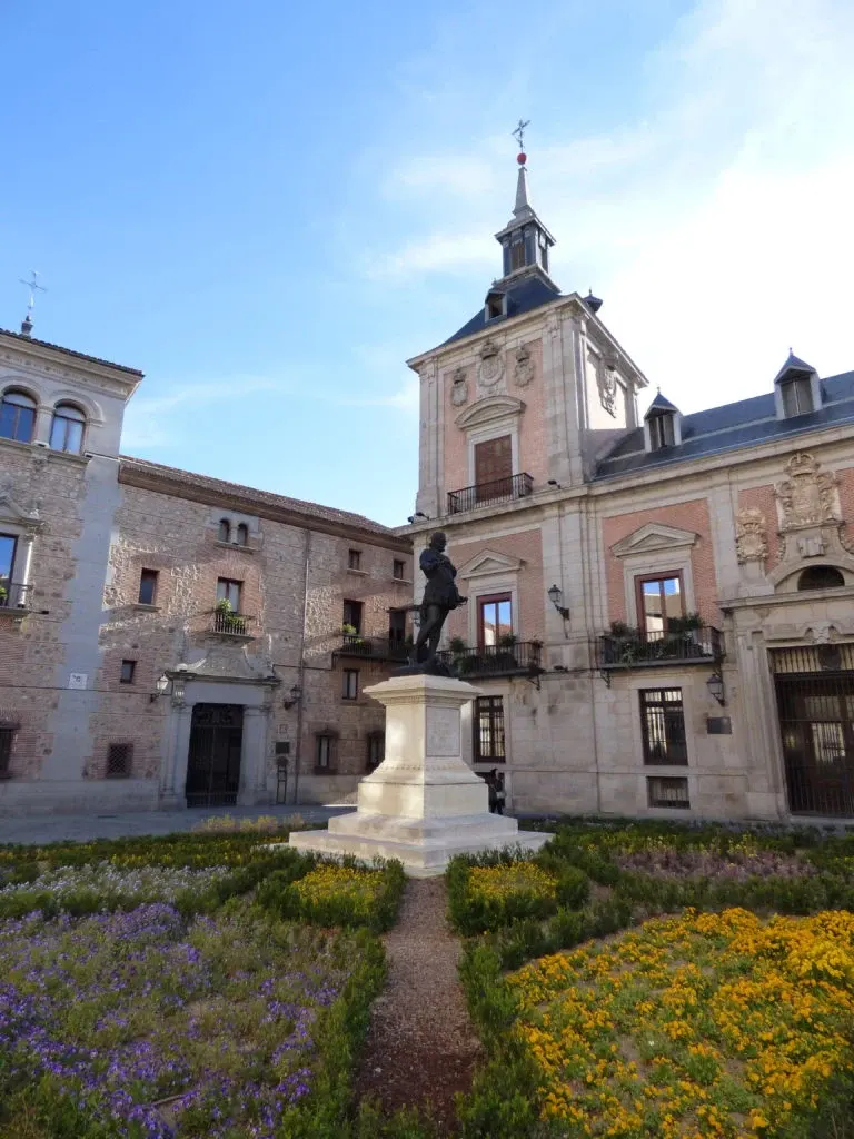 Flower beds in front of an old town hall
