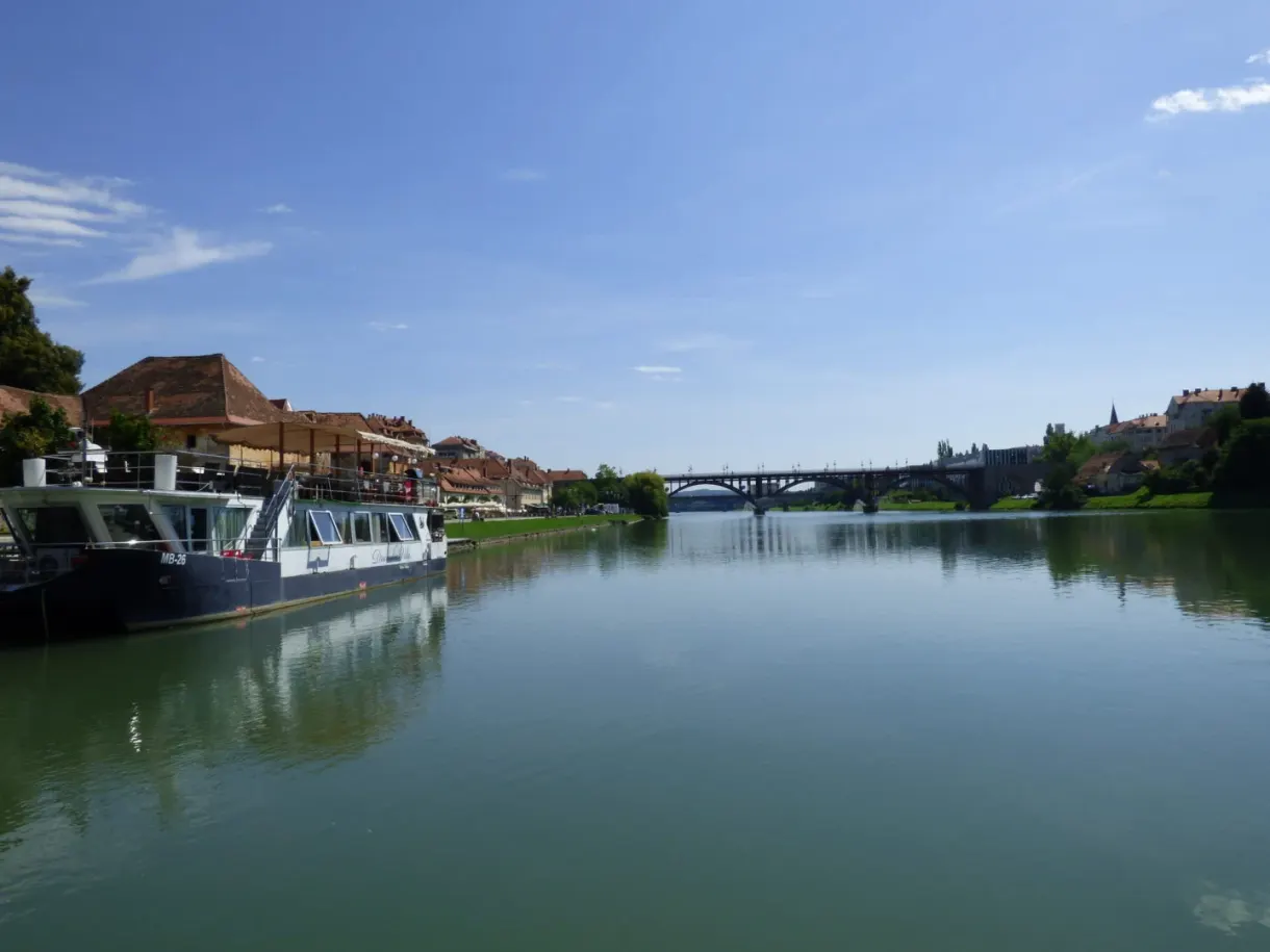 Barge moored on the wide, calm river