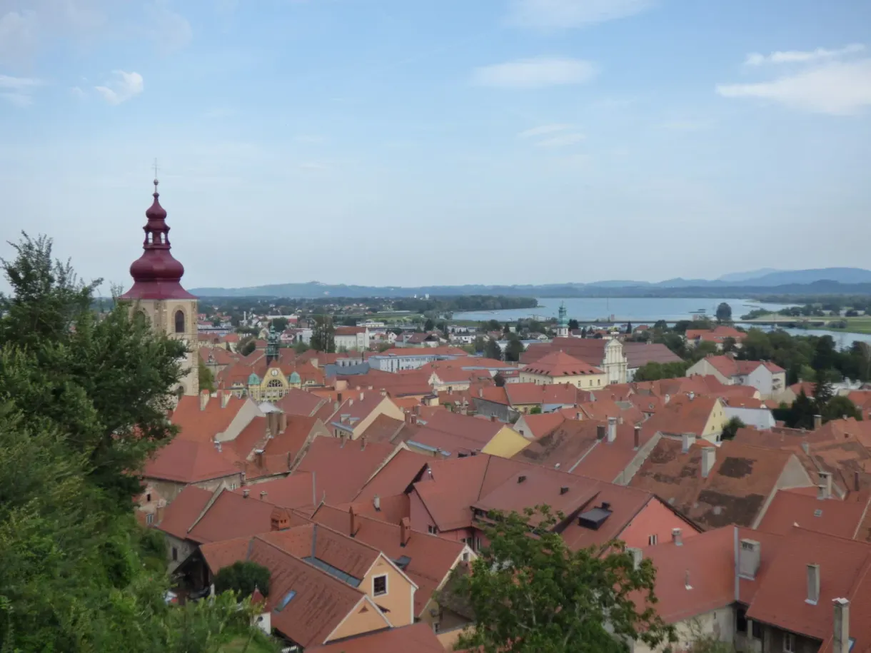 View over the rooftops out to the plain and the river