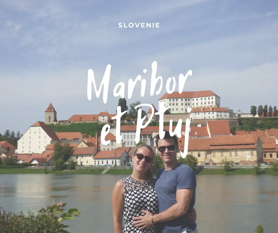 Couple posing in front of the river and the town of Ptuj