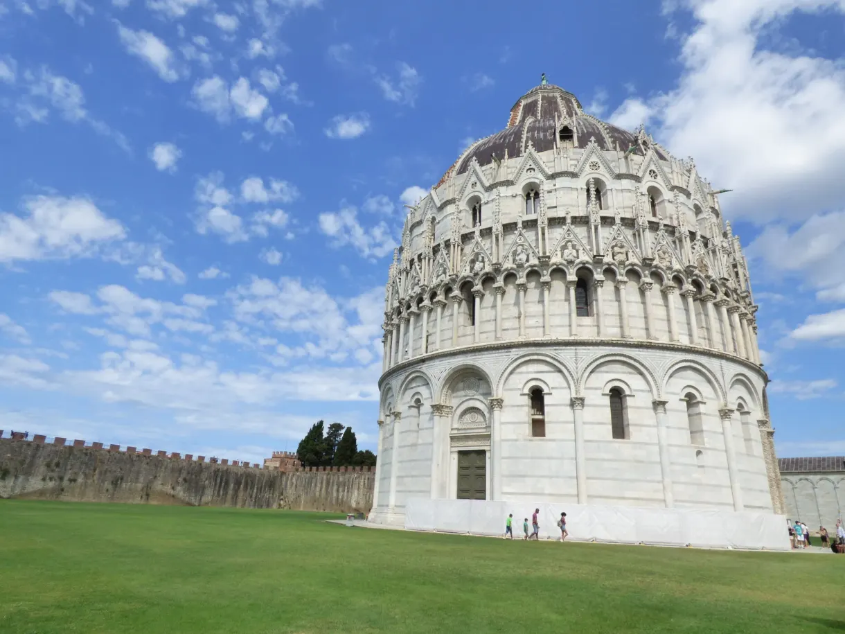 Circular marble baptistery set at the end of the lawn
