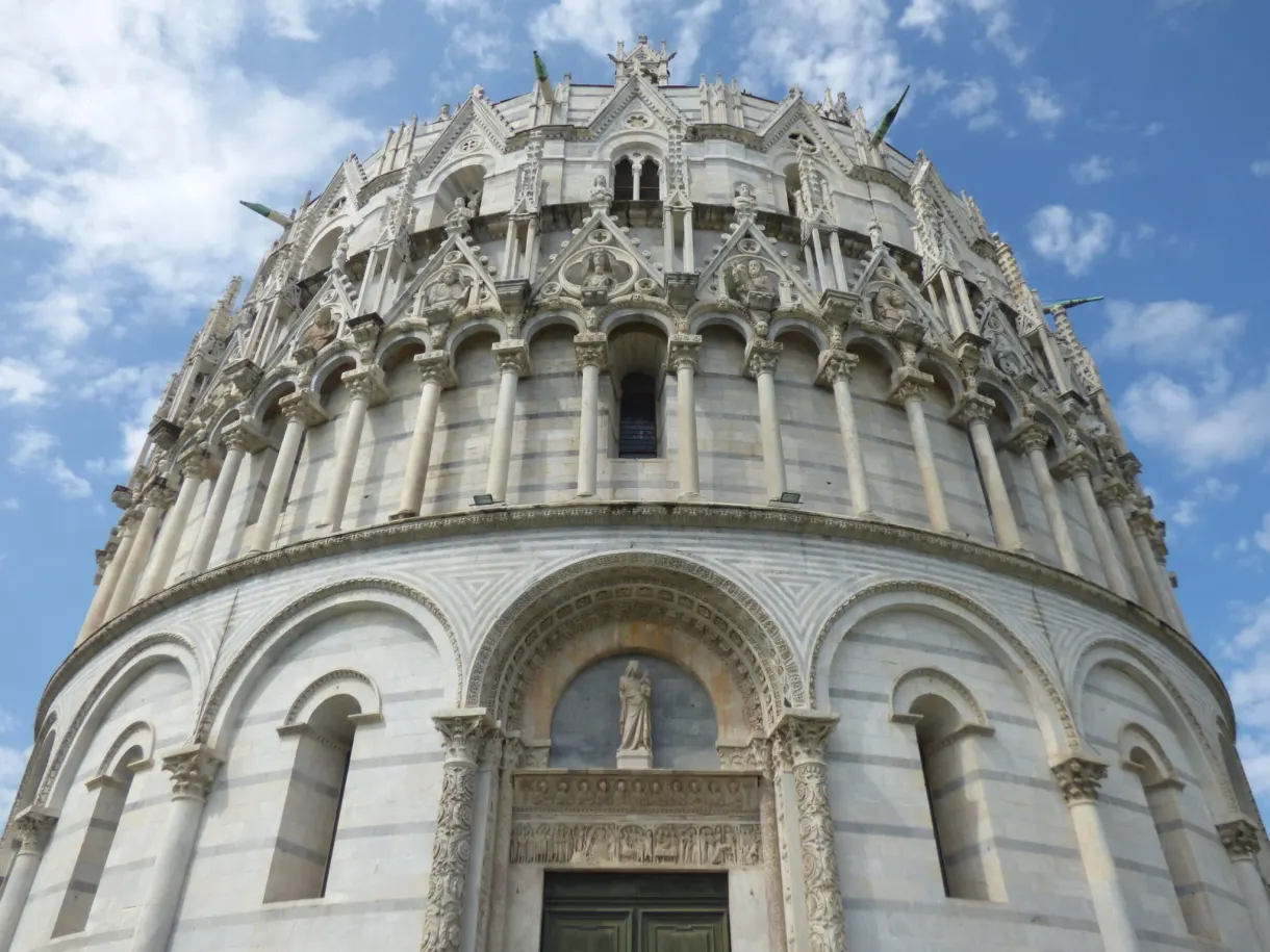 Carved portal and dome of the baptistery seen from below