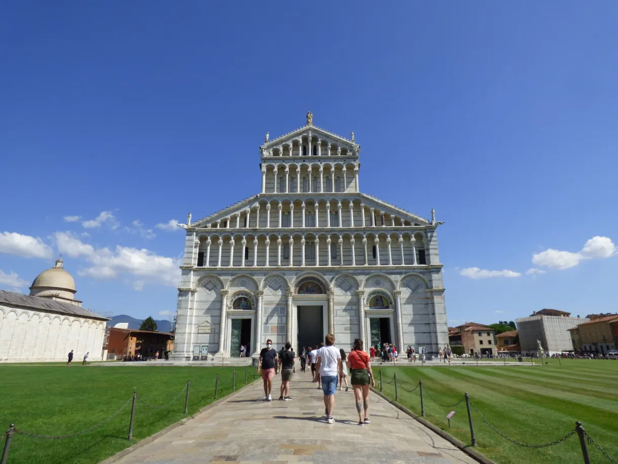 Colonnaded facade of the cathedral, walkers on the path