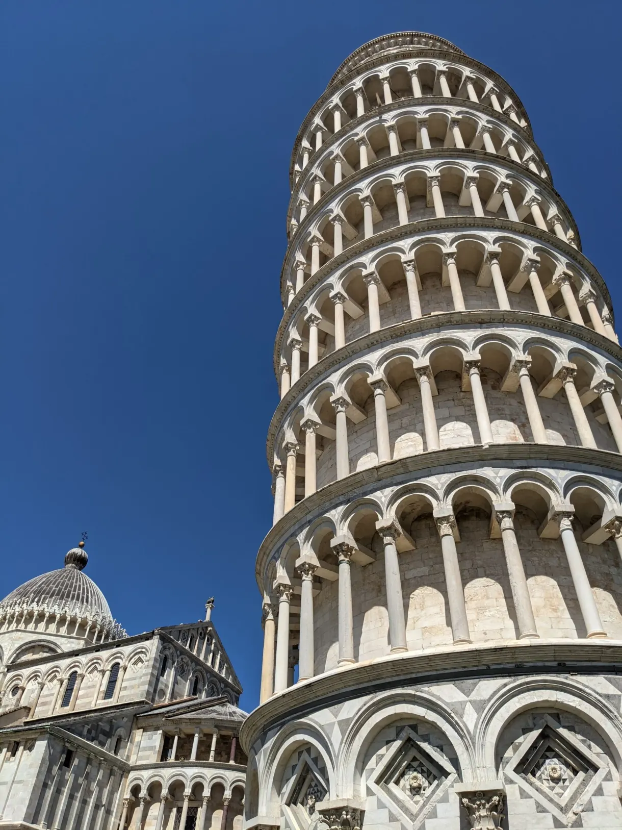 Tight low angle view of the arcaded storeys of the tower