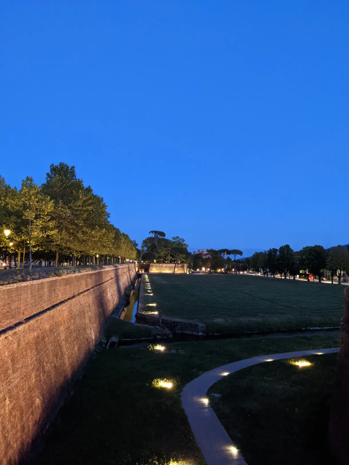 Ramparts and lawn illuminated at blue hour