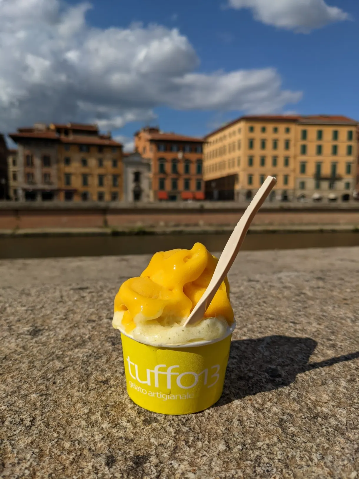 Mango ice cream resting on a parapet facing the facades