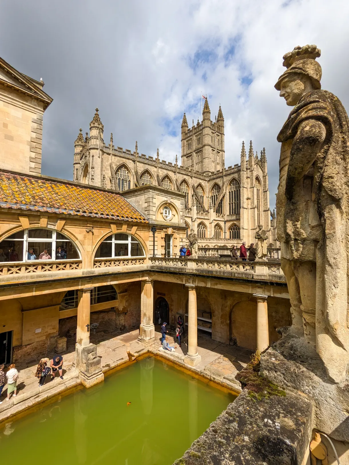 historic baths of Bath with the cathedral in the background of the pool